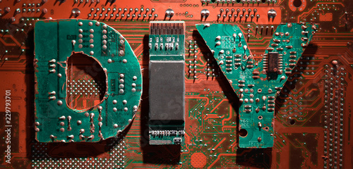 Signboard with Do It Yourself abbreviation made from computer parts