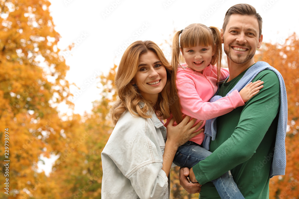 Happy family with child together in park. Autumn walk Happy family with child together in park. Autumn walk