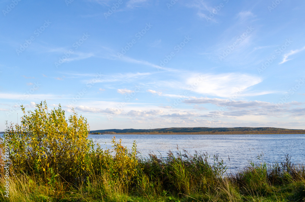 lake in the forest and blue sky with clouds