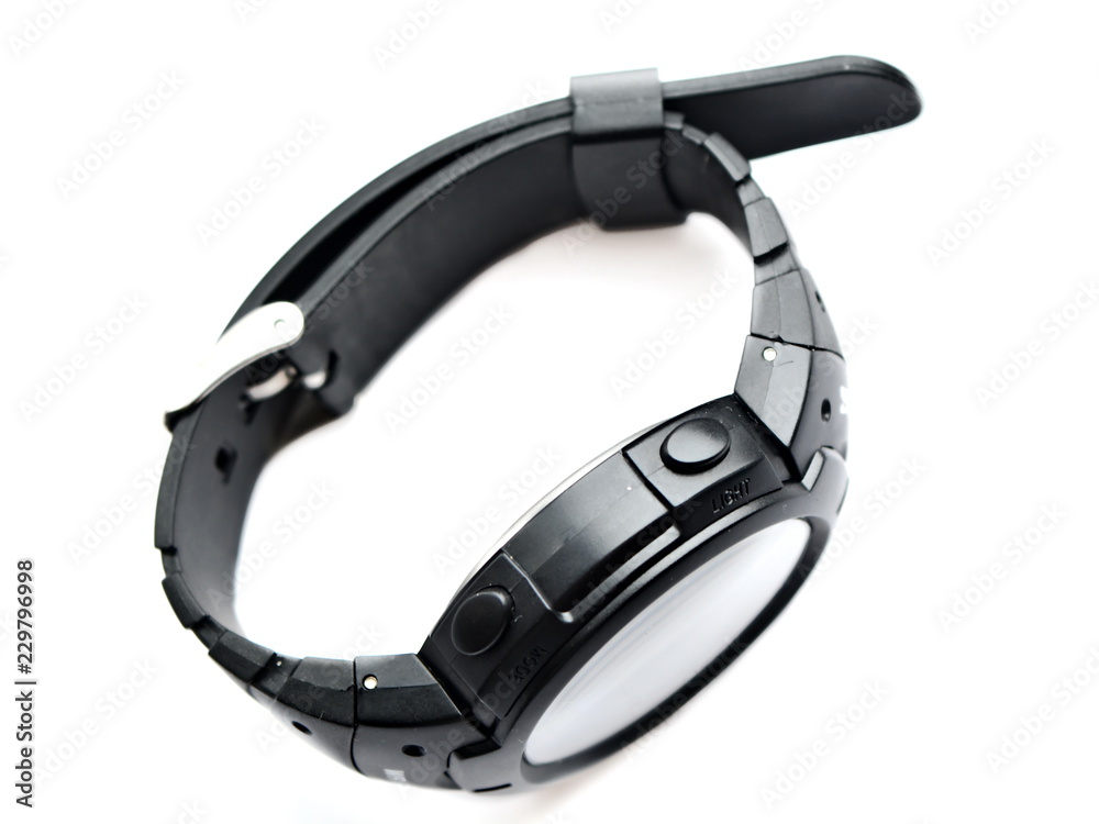Men's electronic modern quartz sport black wrist watch with buttoned rubber strap on white background. Isolated Men's electronic modern quartz sport black wrist watch with buttoned rubber strap on white background. Isolated