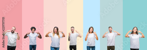 Fotografie, Tablou Collage of different ethnics young people wearing white t-shirt over colorful isolated background smiling confident showing and pointing with fingers teeth and mouth