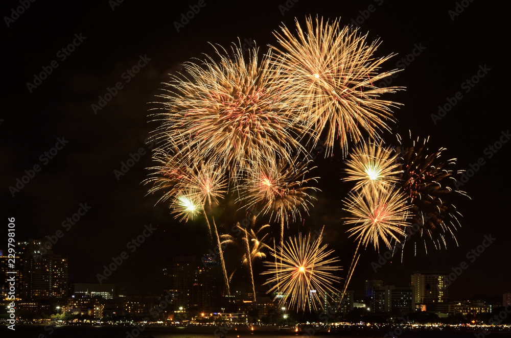 Golden fireworks display on dark sky for the celebration