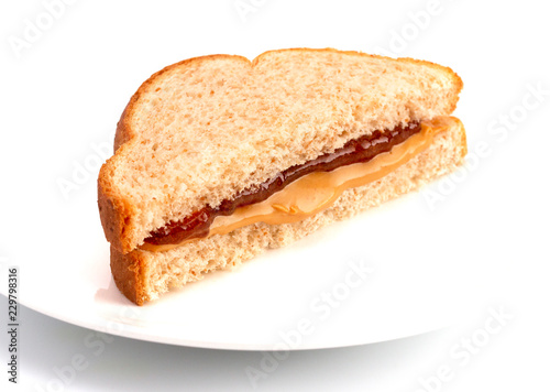 A Classic Peanut Butter and Strawberry Jelly Sandwich on Wheat Bread