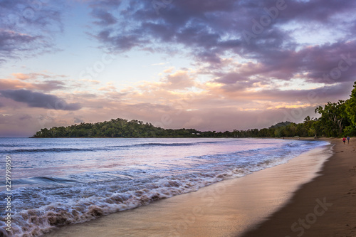 Fototapeta Naklejka Na Ścianę i Meble -  A beautiful beach of the Coral Coast at dusk, Queensland, Australia