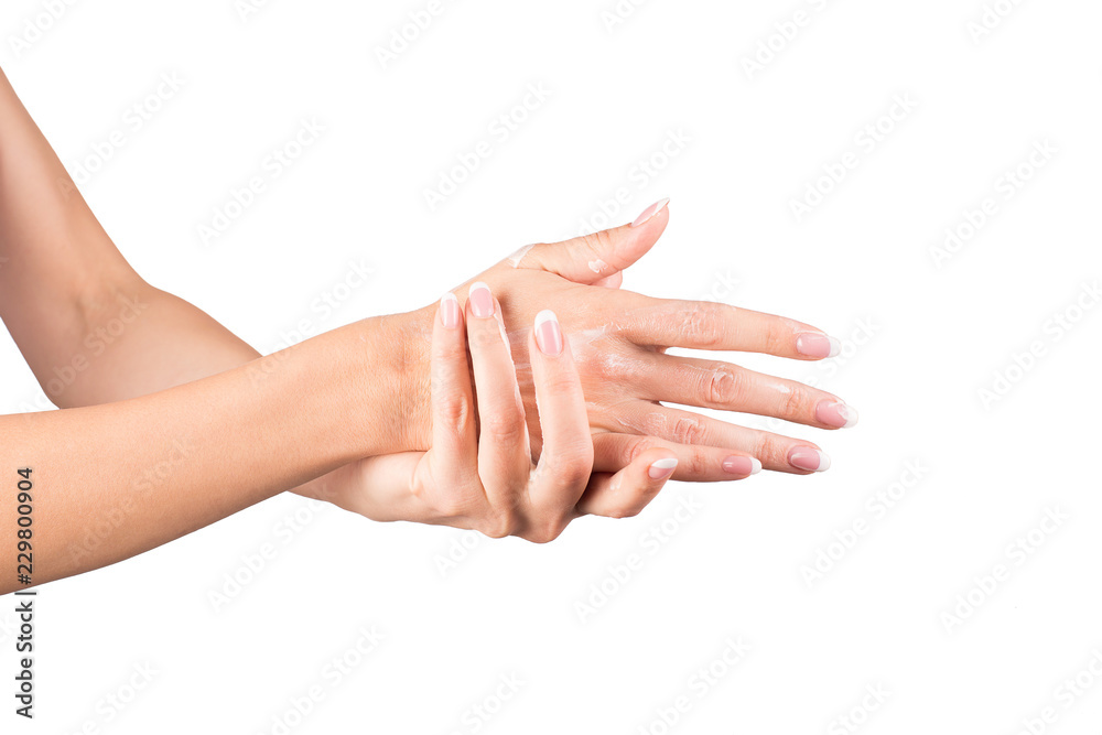 Woman applying cream, female hands, white background, closeup