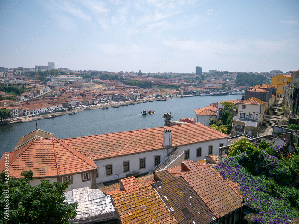 Old buildings near the river bay in the town of Porto, Portugal, historic city center near the bridge