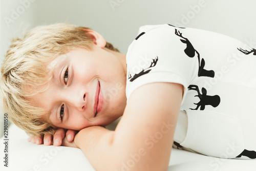 Smiling boy lying down