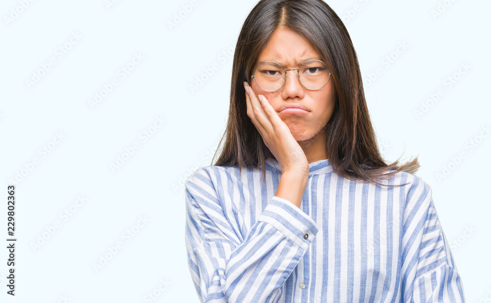 Young asian woman over isolated background thinking looking tired and bored with depression problems with crossed arms. Young asian woman over isolated background thinking looking tired and bored with depression problems with crossed arms.