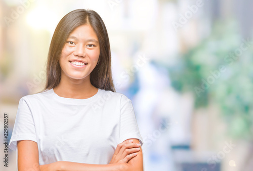 Free Download Young asian woman over isolated background happy face smiling with crossed arms looking at the camera. Positive person. - GFXLoad