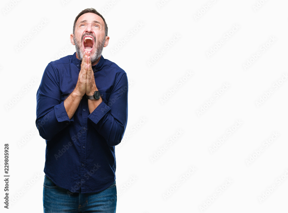 Middle age hoary senior man over isolated background begging and praying with hands together with hope expression on face very emotional and worried. Asking for forgiveness. Religion concept. Middle age hoary senior man over isolated background begging and praying with hands together with hope expression on face very emotional and worried. Asking for forgiveness. Religion concept.