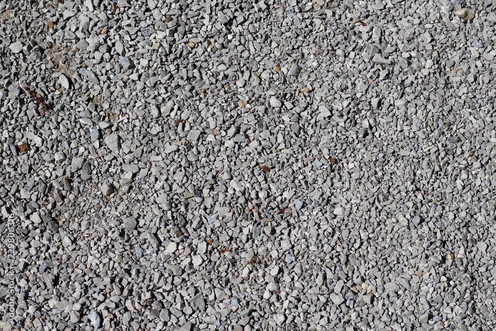 The texture of the pebbles and stones of the gravel. The texture of the pebbles and stones of the gravel.