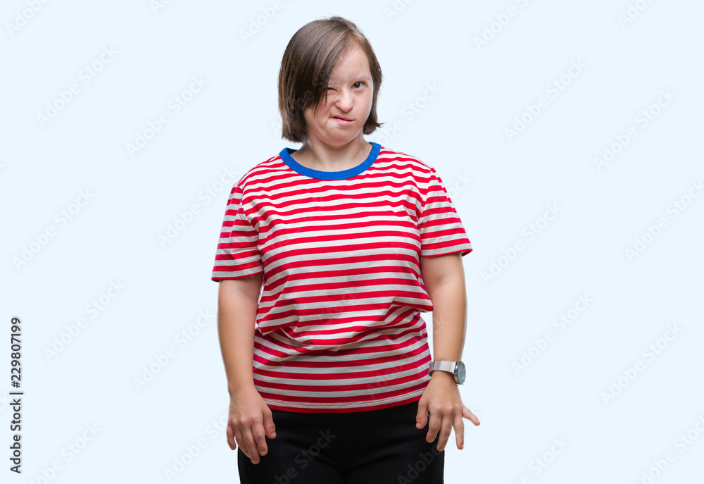 Young adult woman with down syndrome over isolated background winking looking at the camera with sexy expression, cheerful and happy face. Young adult woman with down syndrome over isolated background winking looking at the camera with sexy expression, cheerful and happy face.