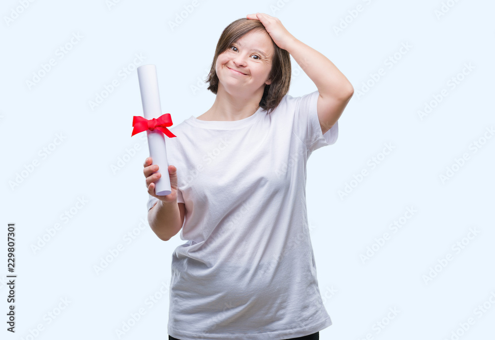 Young adult woman with down syndrome holding degree over isolated background stressed with hand on head, shocked with shame and surprise face, angry and frustrated. Fear and upset for mistake. Young adult woman with down syndrome holding degree over isolated background stressed with hand on head, shocked with shame and surprise face, angry and frustrated. Fear and upset for mistake.