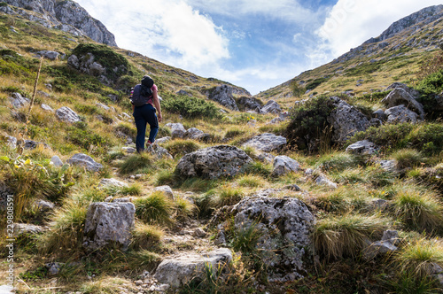 Young man hiking a rocky trail in Galicica National Park.