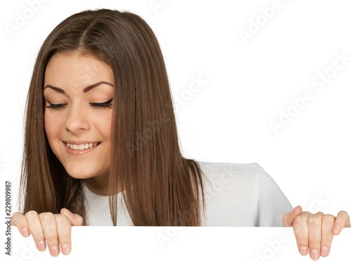 Photos Woman Standing behind Invisible Wall and Looking Down - Isolated