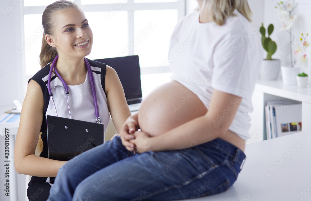 Gynecology consultation. Pregnant woman with her doctor in clinic Gynecology consultation. Pregnant woman with her doctor in clinic