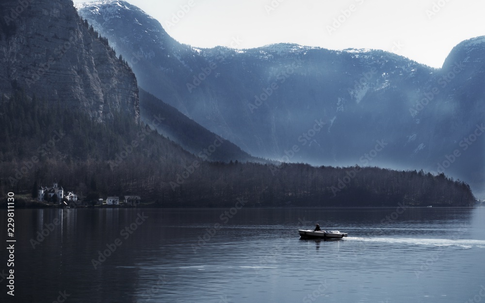 lake in the mountains and boat lake in the mountains and boat