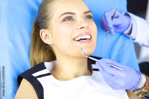 beautiful girl in the dental chair on the examination at the dentist