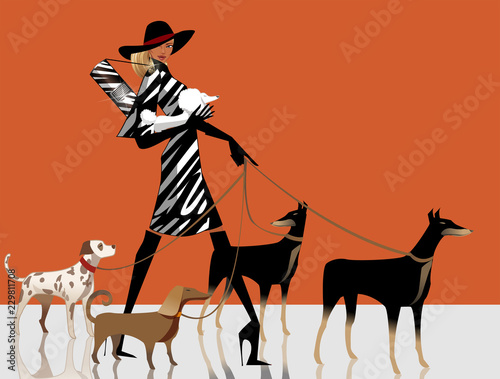 Side profile of a woman walking with her dogs