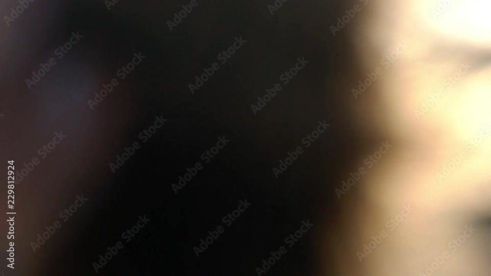Young blonde woman smiling and posing in a city slowmotion at the summer evening. Waving hair and taking photos on mobile phone. Young blonde woman smiling and posing in a city slowmotion at the summer evening. Waving hair and taking photos on mobile phone.