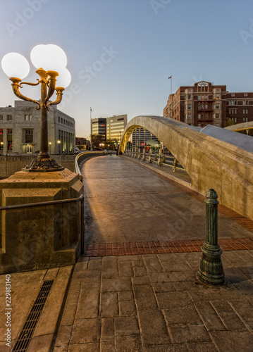 Bridge walkway in Riverwalk District in Reno Nevada with buildings and streetlights.