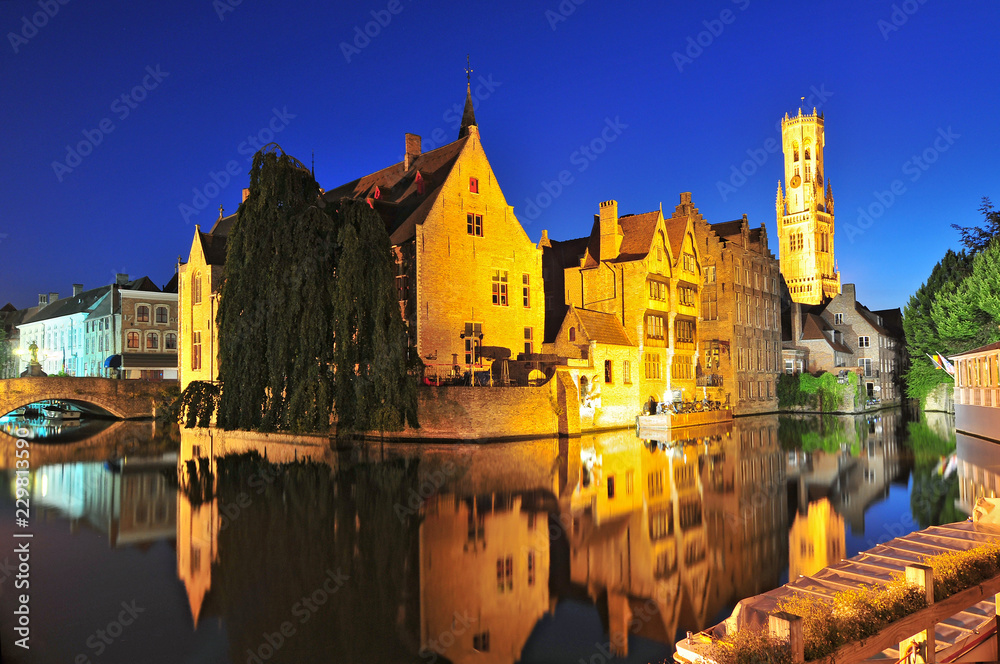 View of canal belfry and houses at Bruges Belgium.