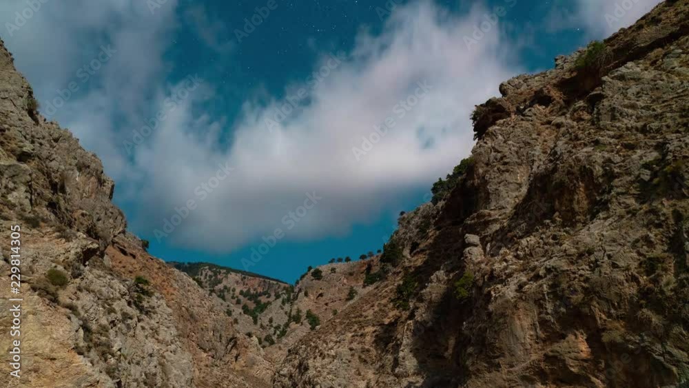 Time lapse of canyon and clouds in moonlight at night Time lapse of canyon and clouds in moonlight at night