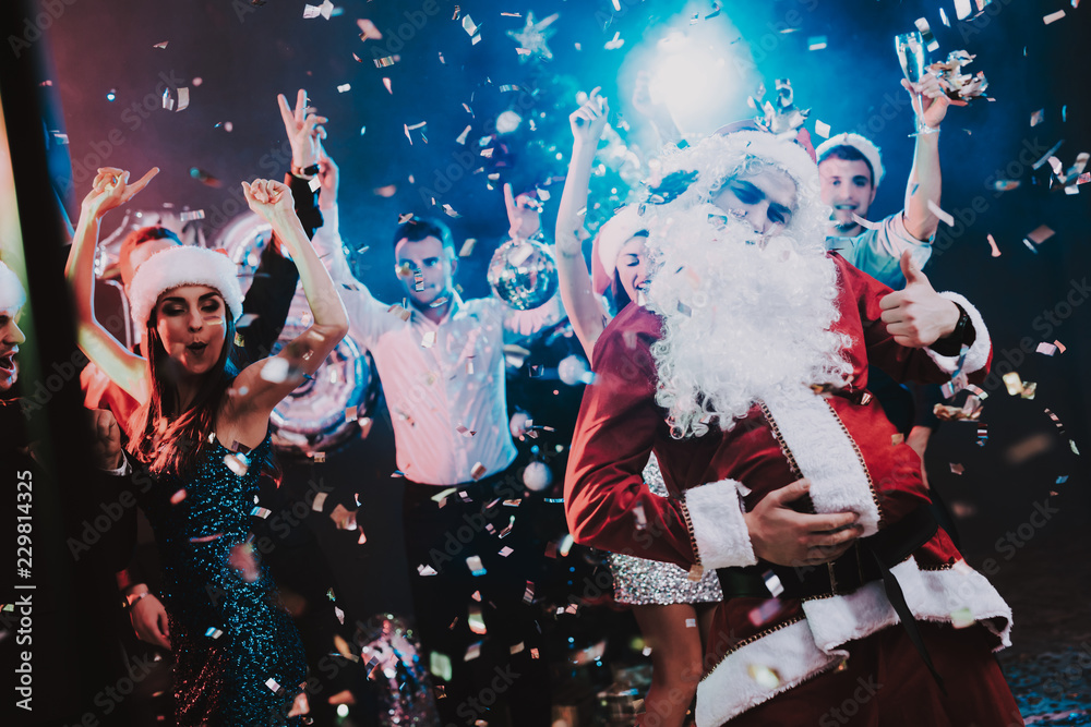 Fototapeta Man in Santa Claus Costume on New Year Party.