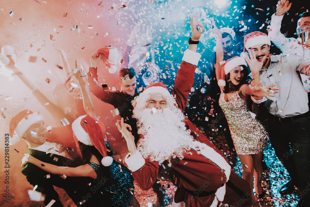 Man in Santa Claus Costume on New Year Party. - obrazy, fototapety, plakaty 