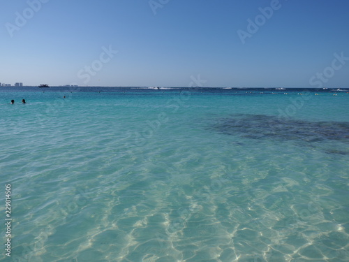 Marvelous view of turquoise waters of Caribbean Sea landscape with horizon line at Cancun city in Mexico