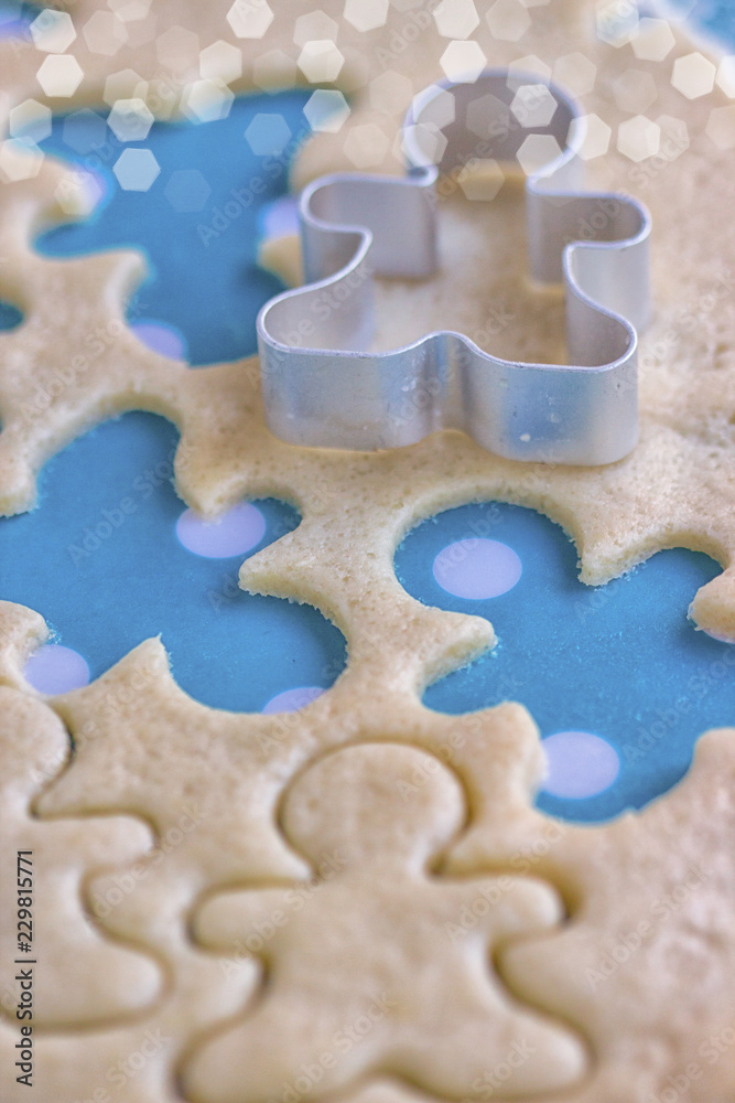 Festive Christmas cookies. Background from sand cookies in the shape of a man. Close up Festive Christmas cookies. Background from sand cookies in the shape of a man. Close up