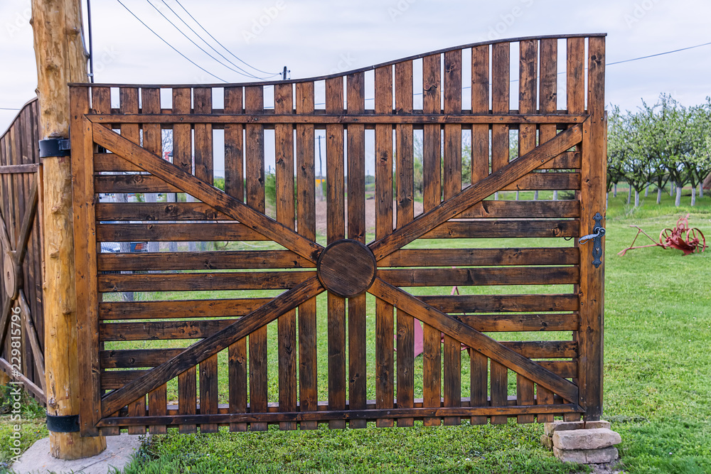 Naklejka premium Old wooden village gate 
