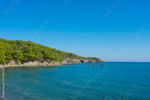 Beautiful landscape, mountains and sea against blue sky. Phaselis Beach in Antalia Turkey 