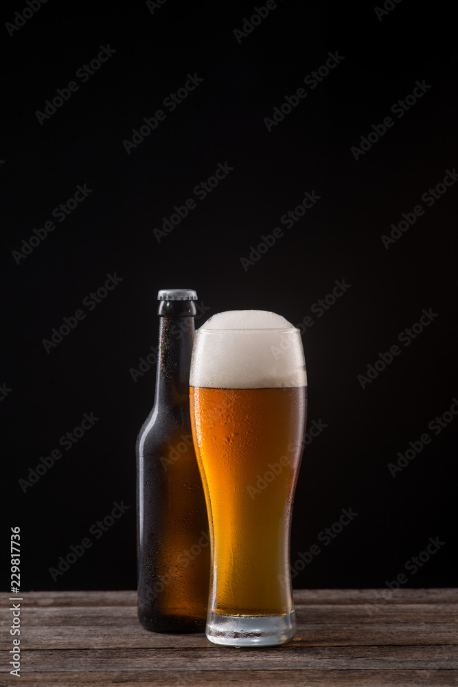 Glass and bottle of ale