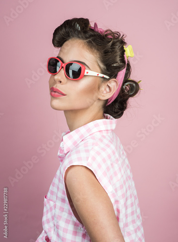 beauty salon and hairdresser. retro woman with fashion makeup. happy girl in summer glasses. Pin up girl. vintage housewife woman make hairstyle. Beauty and fashion. She got great style © Volodymyr