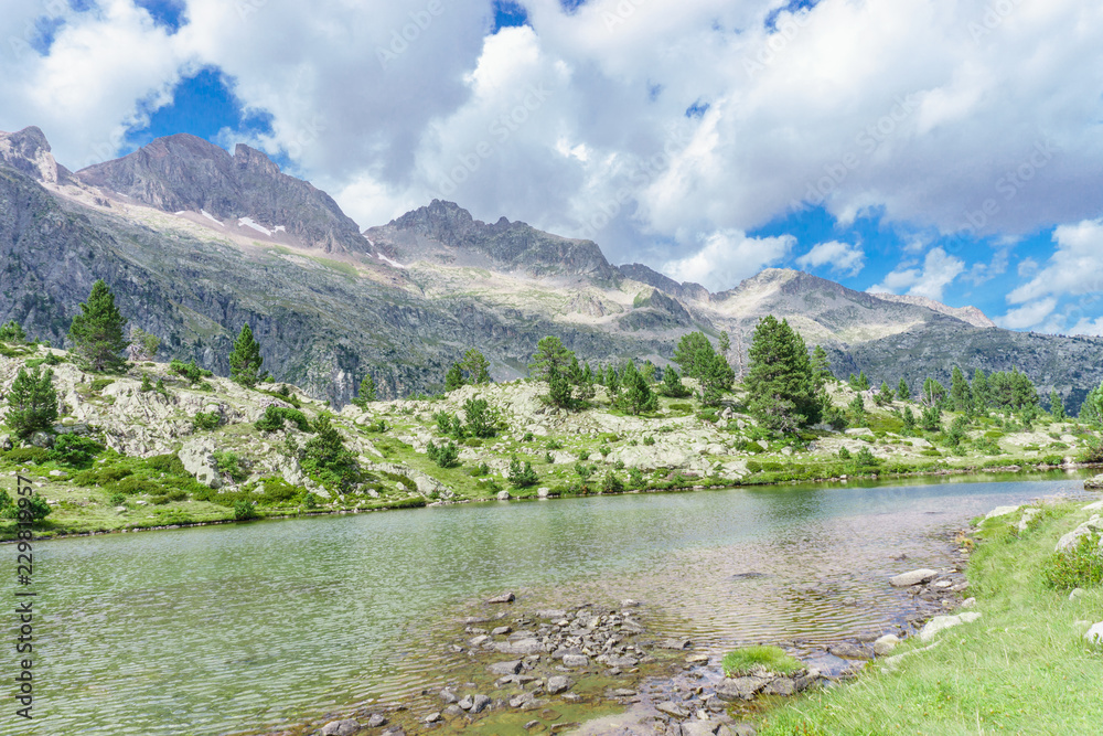 natural landscape, mountain with water from small lake. reflections during sunny day, Spain, aragon, Pyrenees
