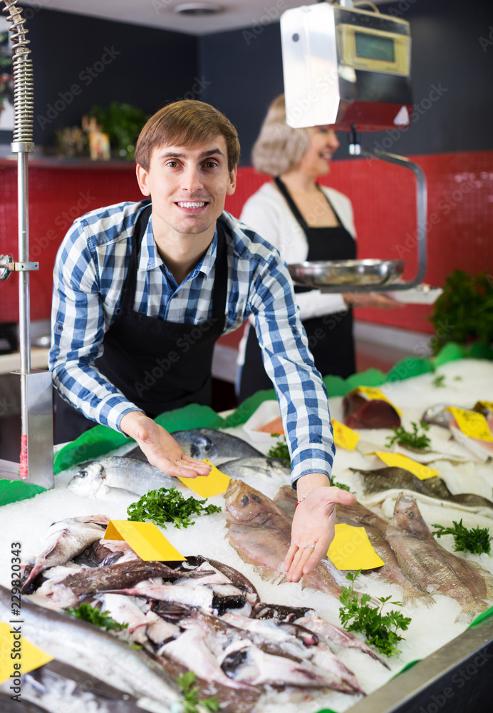 Sellers working in fish store