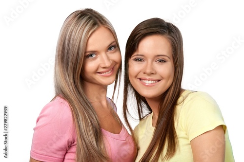 Portrait of Two Smiling Girlfriends / Sisters