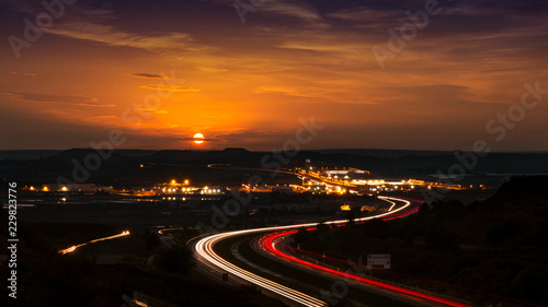 Sun on the Horizon and Road and Traffic in the Dark © pabloprat