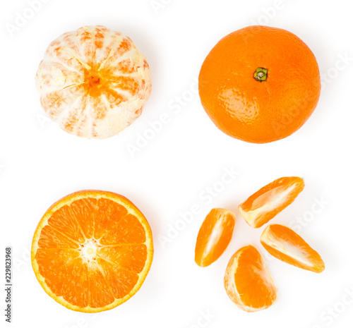 Set of tangerines, peeled, slices and halves on a white. The view from the top.