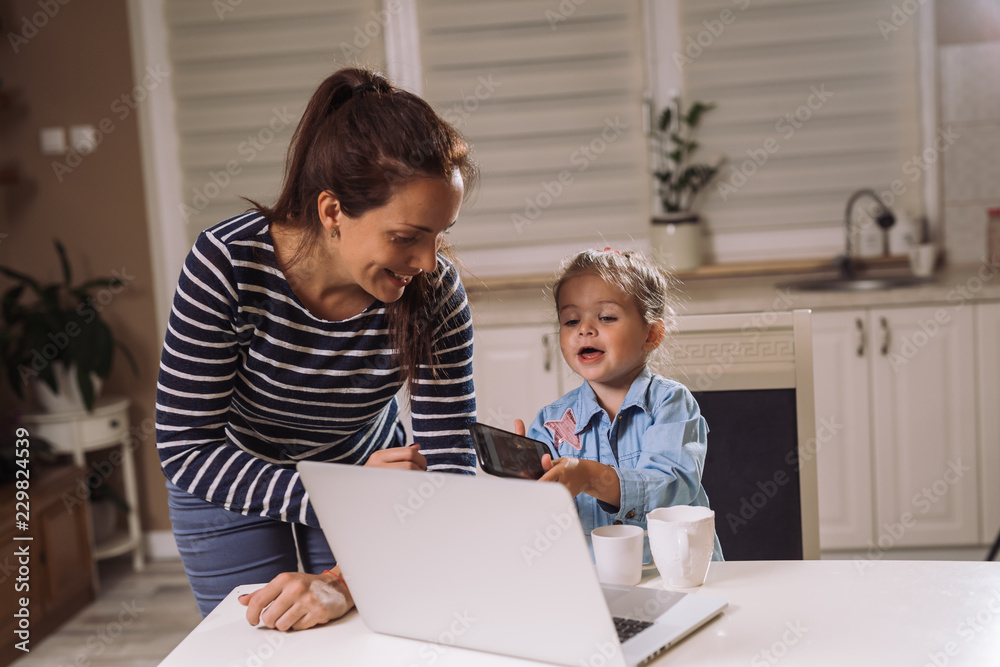 Looking at the family photos on laptop Looking at the family photos on laptop