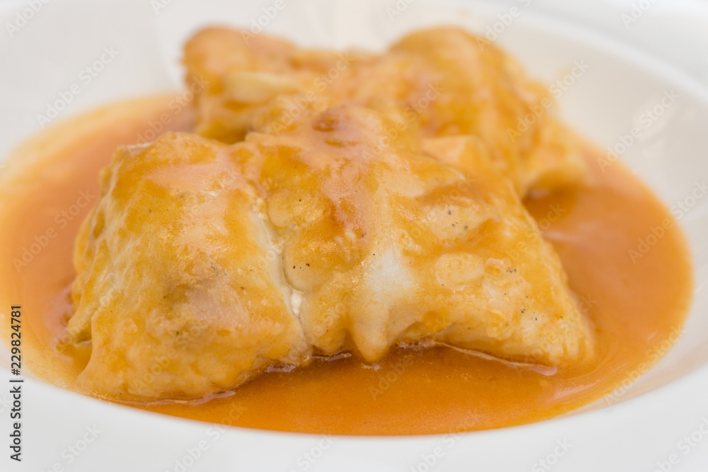 Merluza a la sidra, hake in cider sauce, spanish typical food Merluza a la sidra, hake in cider sauce, spanish typical food
