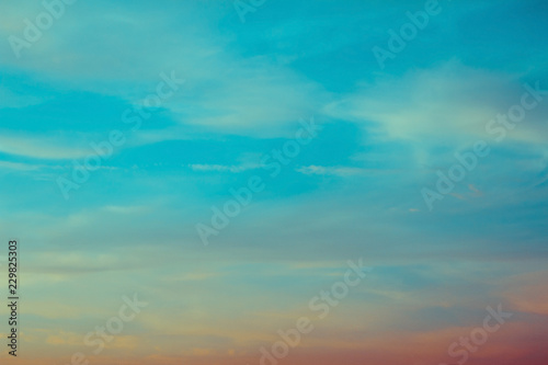 blue and orange sky clouds at sunset or sunrise.