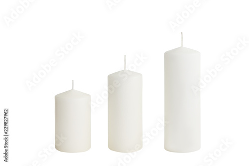 White candle on white background isolated. Wax candle photo