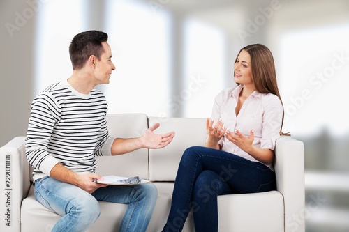 Portrait of smiling couple on sofa at