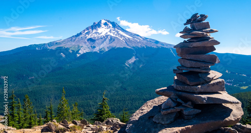 Mount Hood in the distance behind a pile of stones