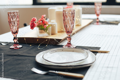 Stylish kitchen decoration with furniture and candles on the table 