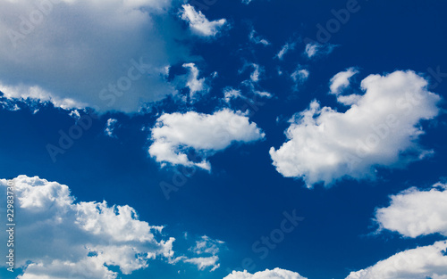 blue sky background with tiny clouds