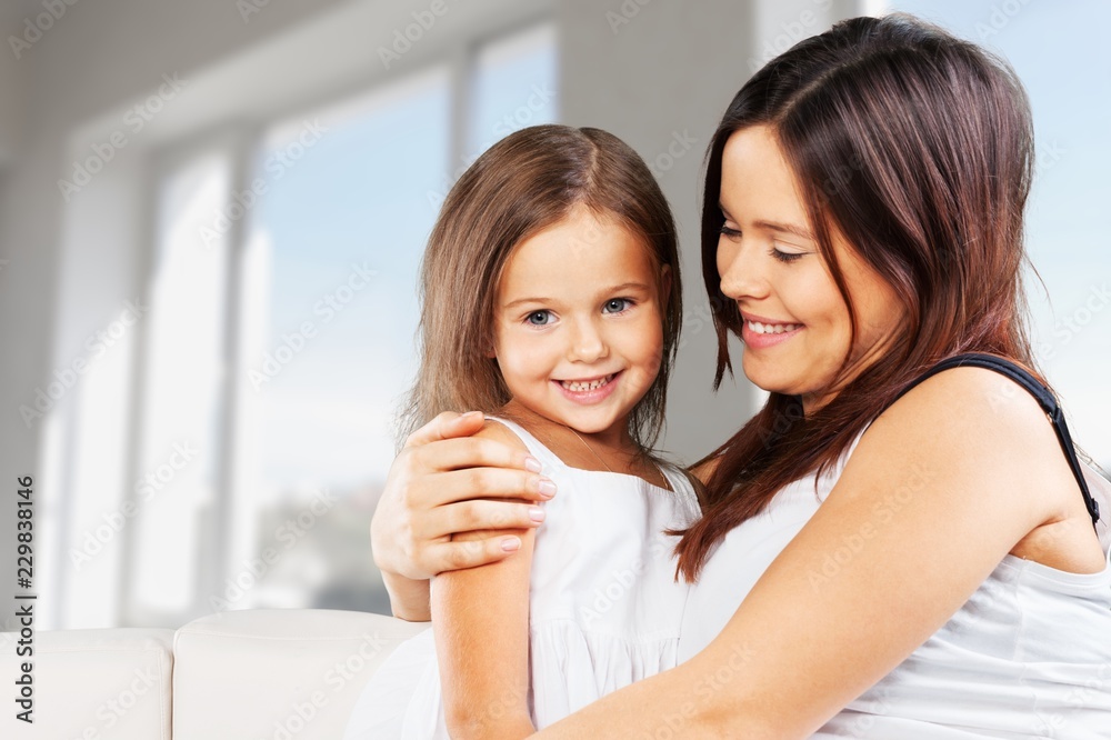 Happy Mother and daughter hugging Happy Mother and daughter hugging