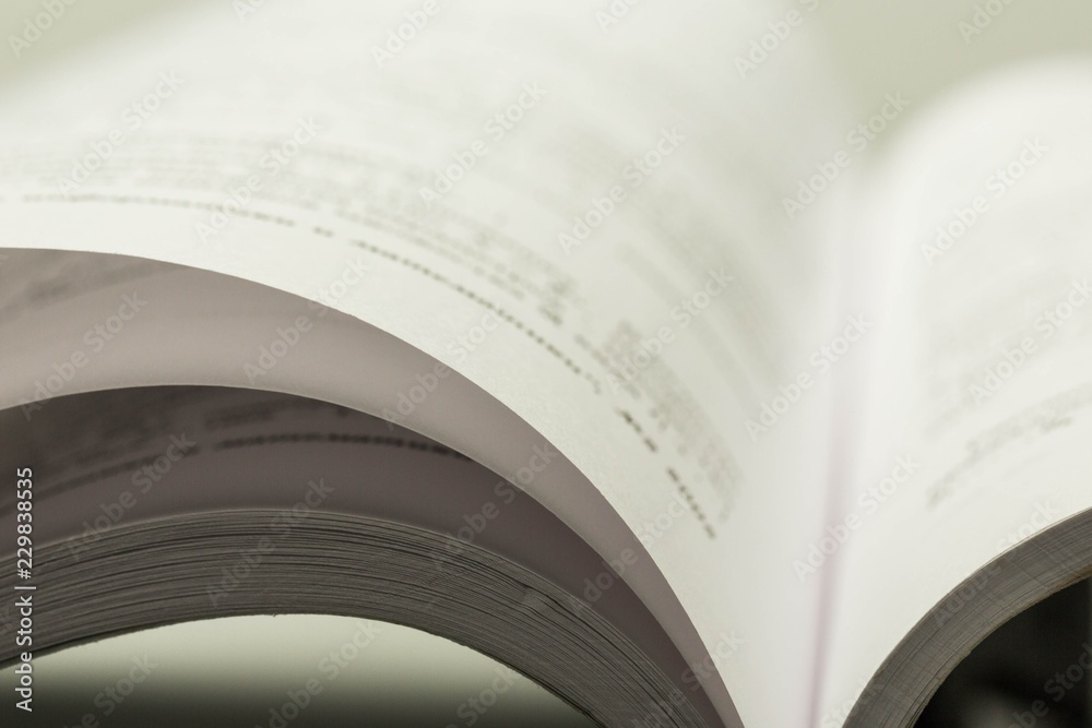 Open Book on the Grey Background - Close Up Open Book on the Grey Background - Close Up